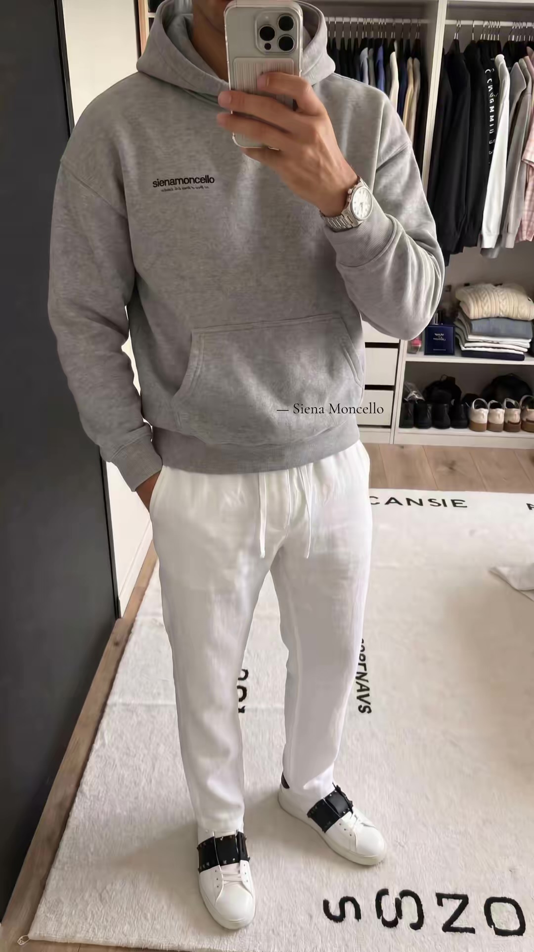 On-model mirror photo of a Siena Moncello grey hoodie and white sweatpants
